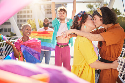 Buy stock photo Lgbt, kiss and couple of friends in city with rainbow flag for support, queer celebration and relationship. Diversity, lgbtq community and group of people enjoy freedom, happiness and pride identity