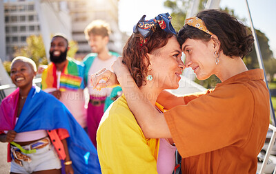 Buy stock photo Pride, lesbian couple and march for lgbtq community, queer and young people in city, outdoor or protest. Love, women and friends in town, relationship or happiness for human rights, freedom and smile