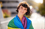 Love, freedom and portrait of woman with pride flag in city, happy non binary lifestyle of equality and peace. Happiness, summer and fun for gender neutral people in lgbt rainbow community with smile