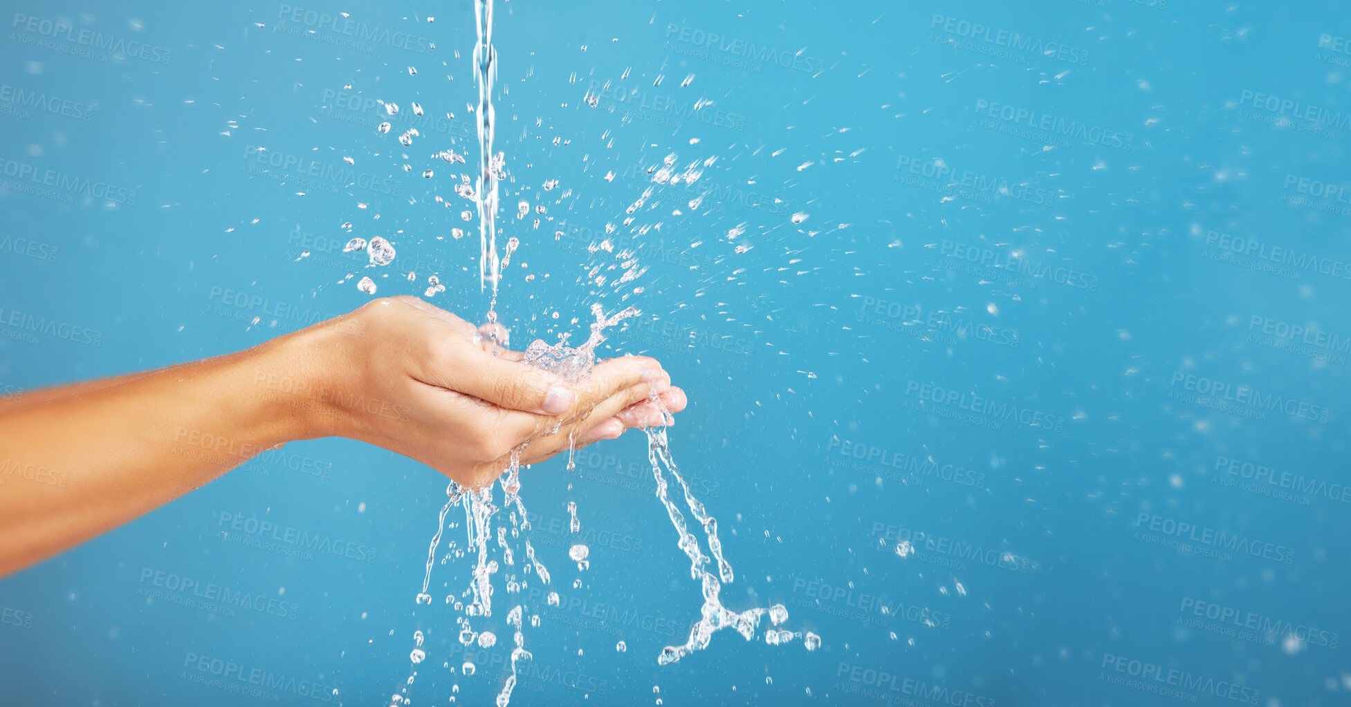 Buy stock photo Cleaning, save and hands with water for hygiene, grooming and washing body on a blue background. Shower, beauty and person saving liquid for health, wellness and mockup space on a studio backdrop