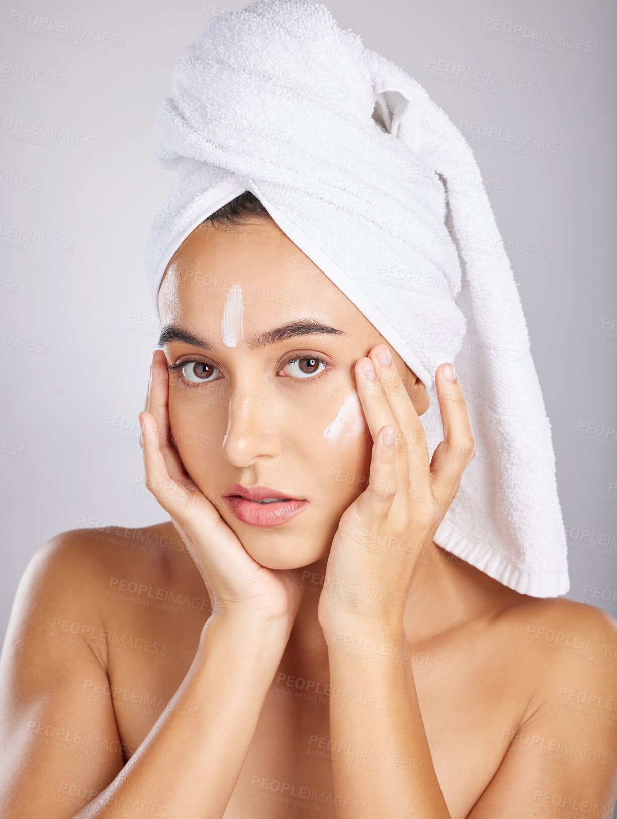 Buy stock photo Skincare, woman model and face portrait with facial moisturizer and spa cream in morning. Towel, sunscreen and skin wellness care of a young person with cosmetic, collagen and dermatology product