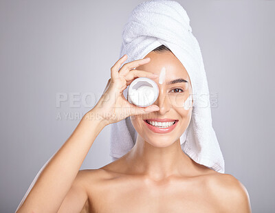 Buy stock photo Woman, face and smile for skincare cream, moisturizer or lotion isolated on a grey studio background. Portrait of happy female holding cosmetic creme for beauty, soft or smooth skin in dermatology