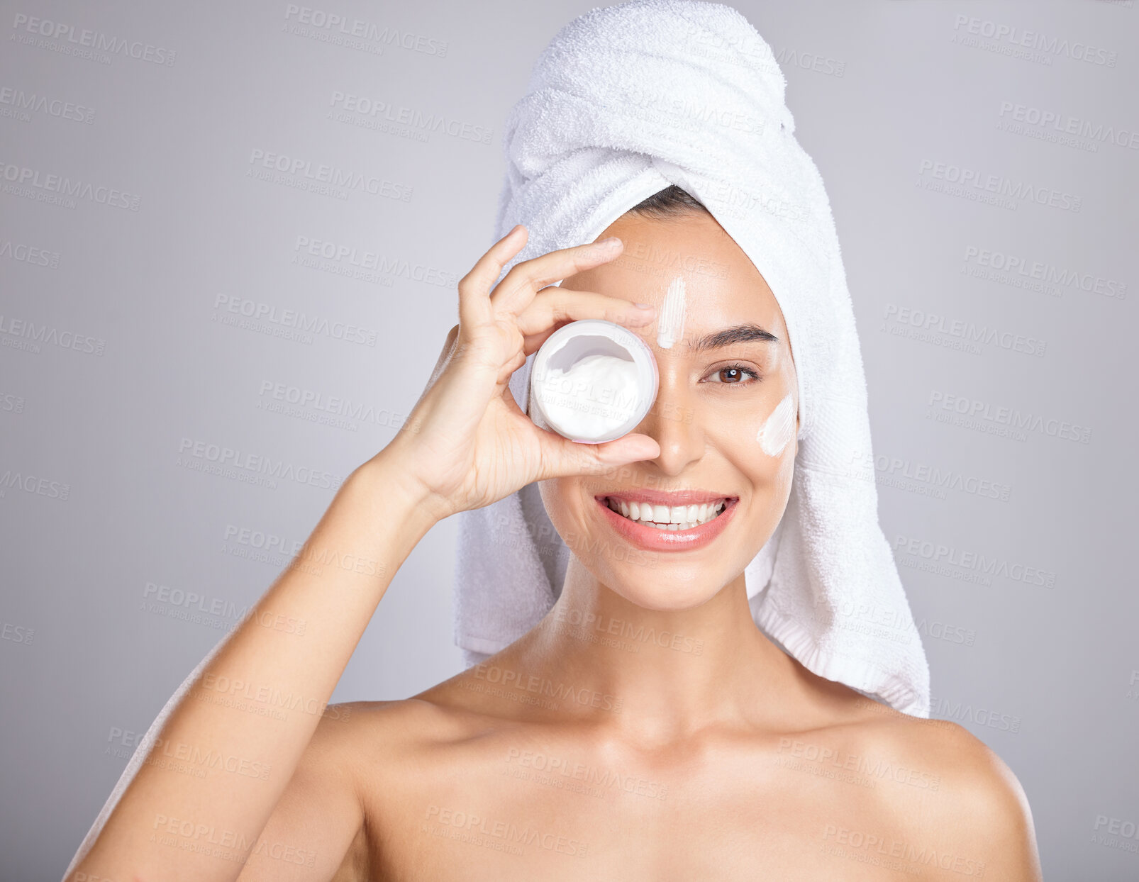 Buy stock photo Woman, face and smile for skincare cream, moisturizer or lotion isolated on a grey studio background. Portrait of happy female holding cosmetic creme for beauty, soft or smooth skin in dermatology