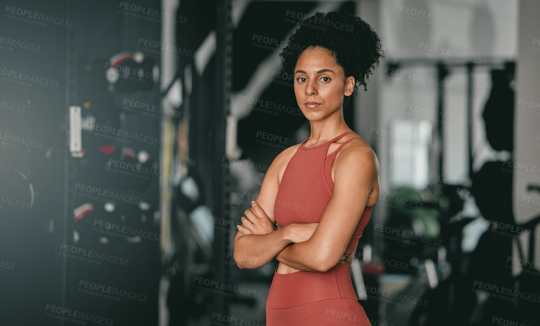 Buy stock photo Black woman, fitness and coach with arms crossed for workout, training or exercise standing in the gym. Portrait of a confident African American female sports instructor with vision for healthy body