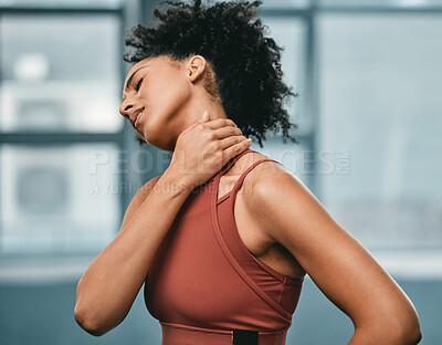 Buy stock photo Fitness, neck pain or black woman in gym with pain or injury after workout exercises or body training alone. Emergency, African girl or injured sports athlete holding sore muscle after bad accident