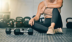 Dumbbells, gym and woman on a health studio club floor ready for training and exercise. Strength challenge, healthy athlete and power workout of an athlete on the ground rest after lifting weights