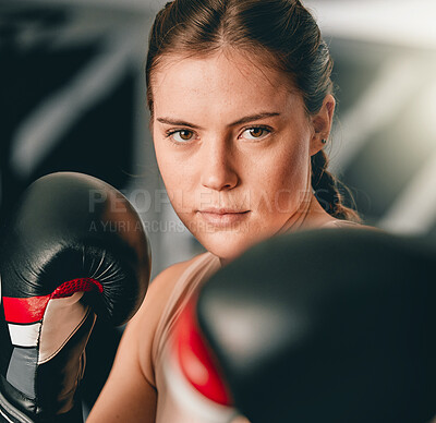 Buy stock photo Boxer, portrait or woman training for fitness in cardio workout or exercise with boxing gloves or focus at gym. Face, girl fighter or healthy sports athlete with courage, power or strong mindset