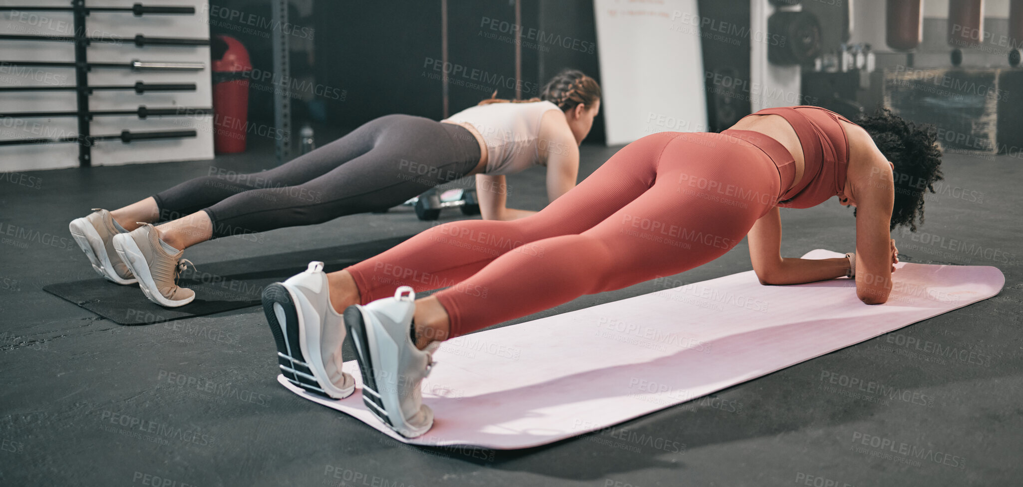 Buy stock photo Gym floor, health and training woman doing plank exercise, performance workout or core muscle building for body self care. Ground, commitment and wellness for team, people or friends in fitness class