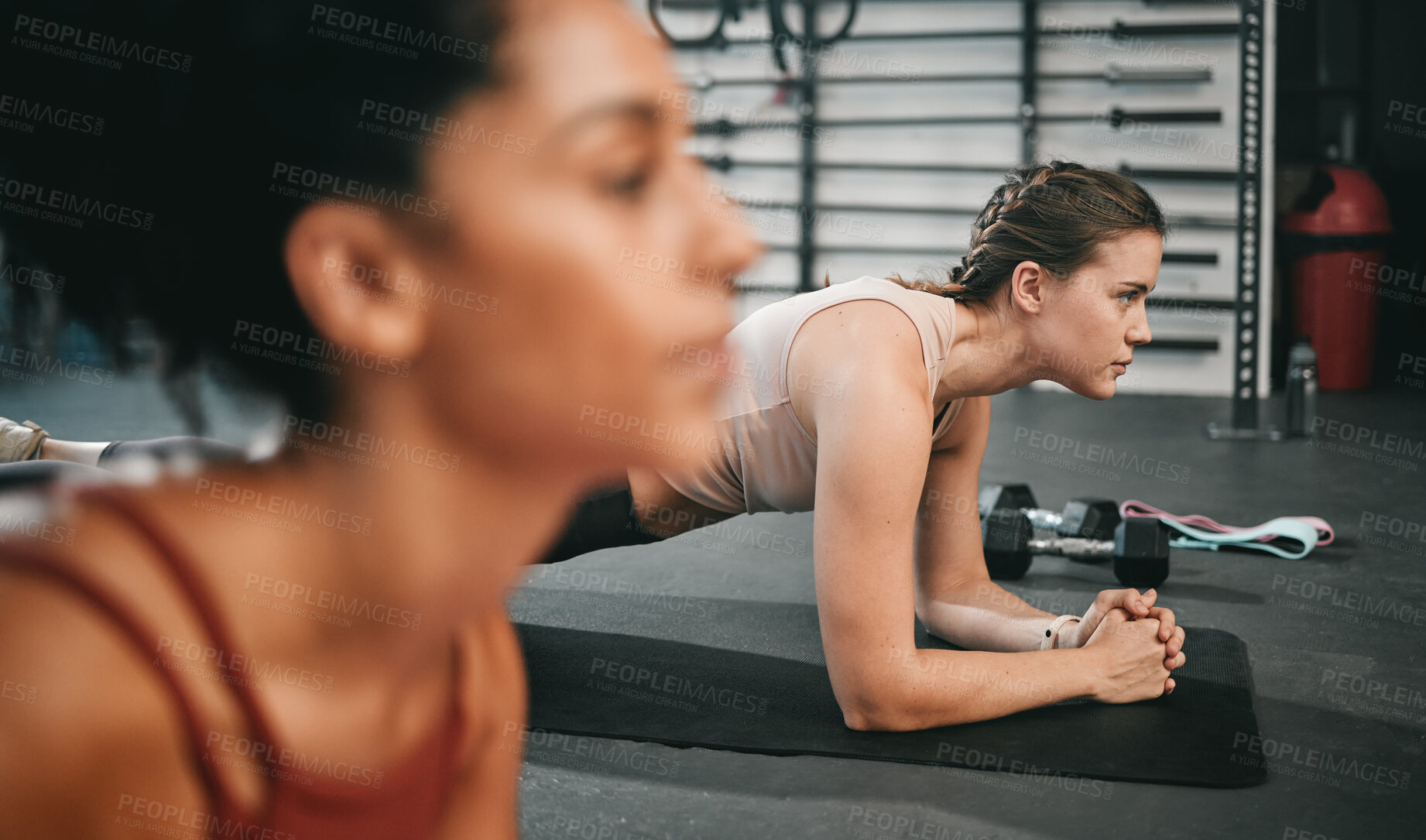 Buy stock photo Woman, fitness and class in plank for core workout, exercise or training together at the gym. Women doing intense ab exercises balancing on mat for strong healthy upper body at the gymnasium