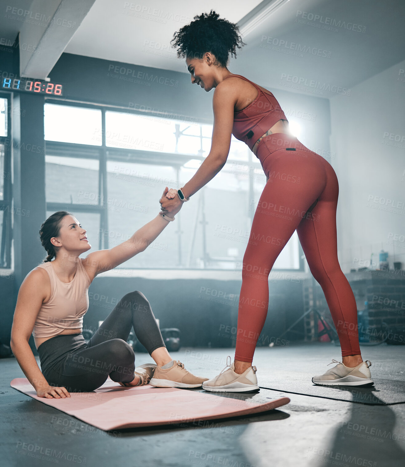 Buy stock photo Fitness, personal trainer or black woman helping a girl client at gym with trust or support after workout or exercise. Partnership, helping hand or healthy sports athlete training with a female coach