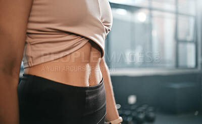 Buy stock photo Fitness, stomach and woman in a gym for exercise, health or wellness for weightloss training. Sports, tummy tuck and closeup of a slim female athlete or model abs after a workout in a sport center.