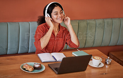 Buy stock photo Headphone, cafe and black woman with music or web podcast working on a computer. Student learning, streaming and radio listening of a happy young person at a coffee shop ready for digital study