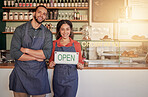 Cafe, portrait or happy couple with a hiring sign for job vacancy offer at a cafe or coffee shop. Manager, black woman or entrepreneurs smile standing advertising an onboarding message in store 