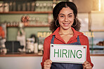 Portrait, small business or black woman with hiring sign for onboarding in a cafe or coffee shop with hospitality.  Restaurant manager with a happy smile with recruitment message after opening store