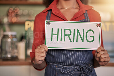 Buy stock photo Small business, hands or business owner with a hiring sign for job vacancy offer at a cafe or coffee shop. Recruitment, marketing or female entrepreneur standing with an onborading message in store

