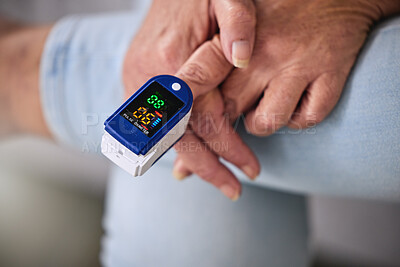 Buy stock photo Pulse oximeter, healthcare and woman taking her heart rate in a retirement home during consultation. Medical, treatment and senior female patient measuring her oxygen blood levels with health device.