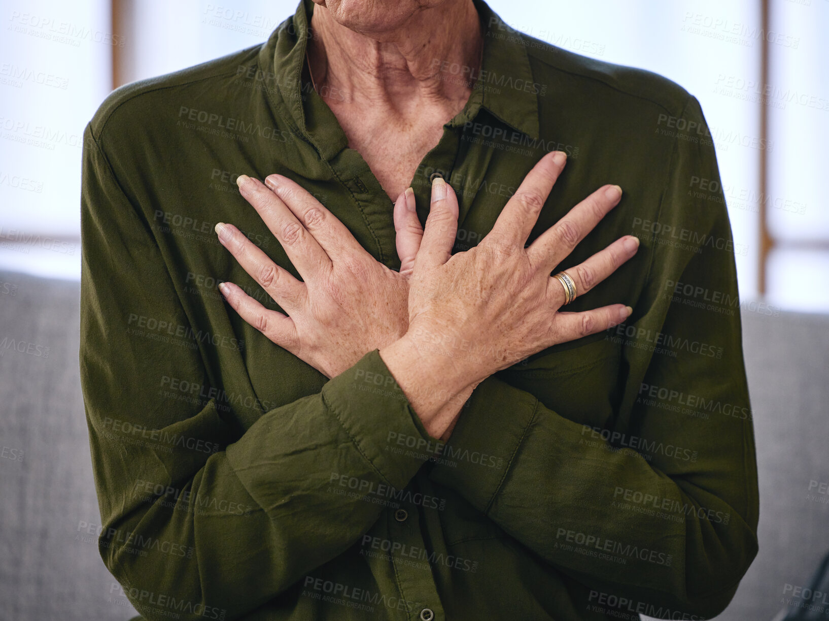 Buy stock photo Senior woman, health and hands on chest for breathing exercise, cardiology care and wellness at home. Healthcare, heart support and elderly female on sofa holding body to breathe, relax and calm