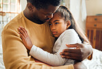 Sick, illness and father with his child with pain, sadness or problem in her bedroom at their home. Ill, care and African dad holding his girl kid with concern while she has the flu, cold or fever.