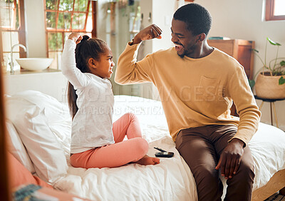 Buy stock photo Healthcare, diabetes and muscle of father and girl in bedroom for brave, proud and strong gesture. Love, family home and dad helping child with monitor for glucose, sugar level test and insulin