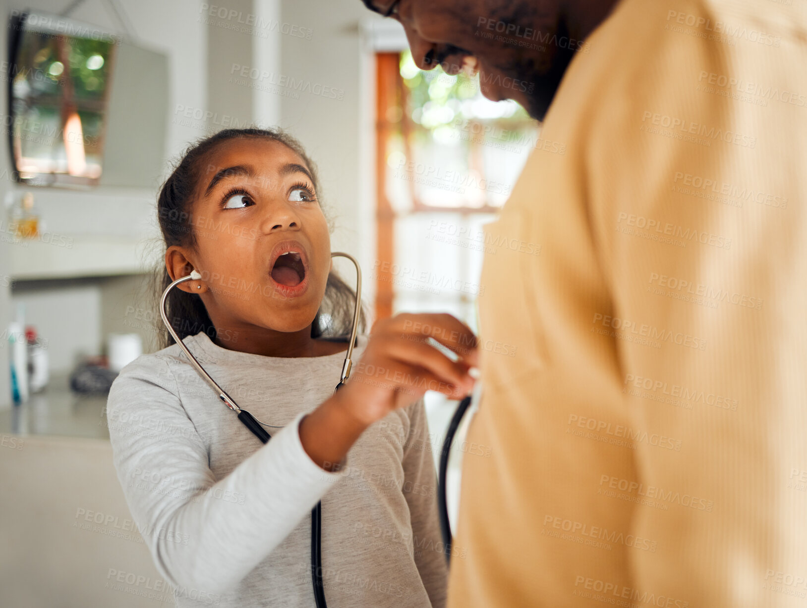 Buy stock photo Surprise, stethoscope and girl play with father, caring and bonding in home. Black family, wow and shocked kid holding medical toy, listening to heartbeat of man and acting as doctor while having fun