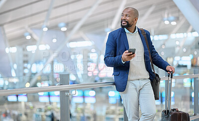 Buy stock photo Businessman, phone and luggage at airport for travel, journey or checking flight times or destinations. Happy black man, person or employee holding smartphone for schedule, traveling or work trip