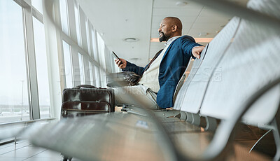 Buy stock photo Relax, travel or black man with phone for internet, website search or communication in airport lobby. Smile, happy or girl on tech for communication, networking or social media app in London lounge