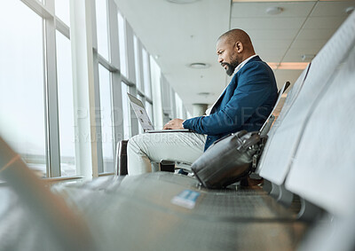 Buy stock photo Travel, vip and businessman on a laptop at an airport working and waiting at terminal or boarding lounge. Entrepreneur, corporate or professional using computer at airline hub about to go on a flight