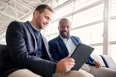 Buy stock photo Business people, tablet and waiting at airport for schedule, travel or work trip journey together. Employee workers holding touchscreen for meeting, communication or planning for traveling or flight