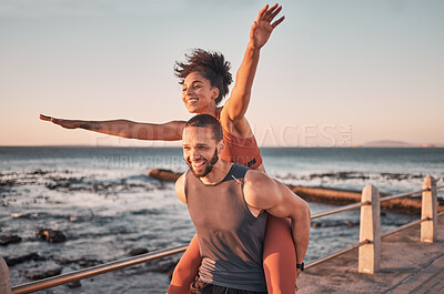 Buy stock photo Sunset, relax and couple piggyback by ocean enjoying holiday, vacation and quality time on weekend. Love, freedom and happy black man and woman after exercise, fitness workout and training by sea