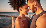 Black couple, smile and hug with forehead by beach embracing relationship, compassion or love and care. Happy man and woman touching heads smiling in happiness for support, trust or romance in nature