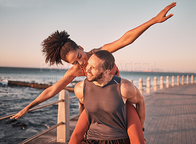 Buy stock photo Beach, fitness and couple piggyback at sunset happy for summer holiday, vacation and quality time on weekend. Love, dating and black man and woman relax after exercise, workout and training by ocean