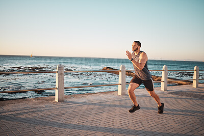 Buy stock photo Running, sea and mockup with a man runner training outdoor on the promenade for cardio or endurance. Fitness, ocean and mock with a sports male taking a run on the coast for health or wellness