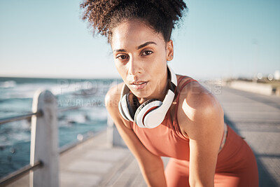Buy stock photo Portrait, fitness and tired with a black woman runner on the promenade for cardio or endurance exercise. Running, workout or breathing with a young female athlete training outdoor by the sea