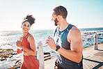Running, fitness and sea with a sports couple outdoor during summer for cardio or endurance exercise. Health, training and ocean with a man and woman runner on a promenade for a workout together