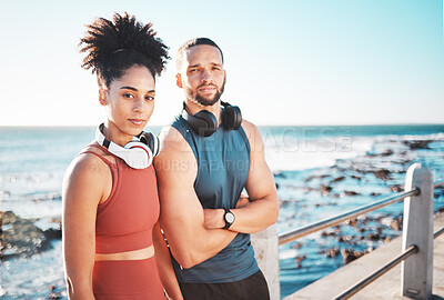 Buy stock photo Portrait, exercise and serious with a couple by the sea for a workout or running for cardio and endurance together. Fitness, runner and mockup with a sports man and woman training by the ocean