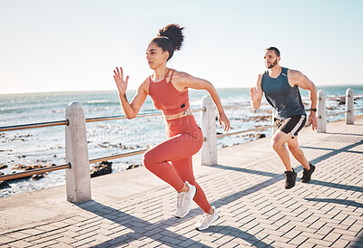 Buy stock photo Running, fitness and ocean with a sports couple outdoor during summer for cardio or endurance exercise. Health, training and sea with a man and woman runner on a promenade for a workout together