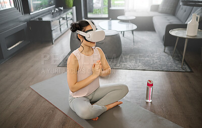 Buy stock photo Virtual reality, meditation and fitness with a woman using a headset to access the metaverse in her home for health. VR, yoga and exercise with a young female yogi meditating in her house using 3d ai