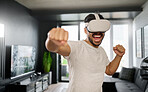 VR, angry and man boxing with glasses, training for a fight and match. Futuristic, digital sports and gamer punching while playing in an augmented reality game online with technology in a house