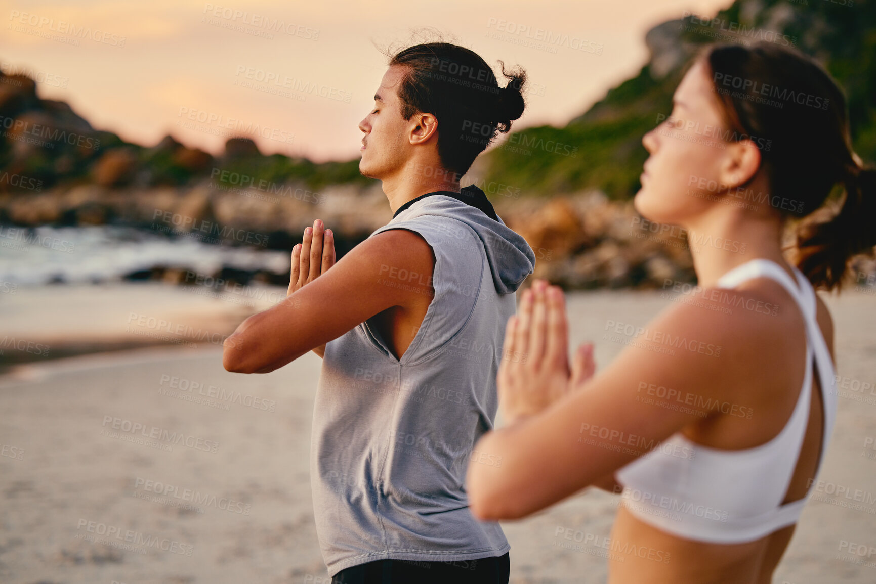Buy stock photo Couple, prayer hands and yoga meditation at beach outdoors for health and wellness. Sunset, pilates fitness and man and woman with namaste hand pose for training, calm peace and mindfulness exercise