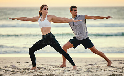 Buy stock photo Warrior pose, couple and beach yoga at sunset for health, fitness and wellness. Exercise, zen chakra and man and woman stretching, training and practicing pilates for balance outdoors at seashore.