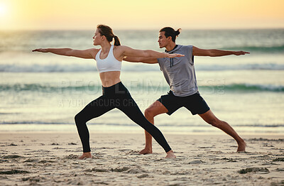 Buy stock photo Couple, warrior pose and beach yoga at sunset for health, fitness and wellness. Exercise, zen chakra and man and woman stretching, training and practicing pilates for balance outdoors at seashore.