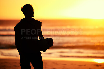 Buy stock photo Sunset, silhouette and man with yoga mat at beach getting ready for training. Pilates, zen chakra and shadow outline of male yogi preparing for meditation, workout or mindfulness exercise at seashore