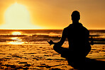 Lotus, yoga and silhouette of man at beach outdoors for health and wellness. Sunset, zen meditation and shadow or outline of male yogi meditating, chakra training and mindfulness exercise at seashore