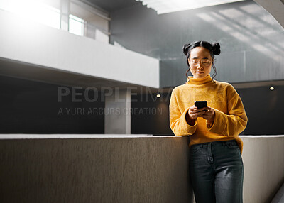 Buy stock photo Woman, phone and texting in office building, relax and calm while on internet, search and reading. Asian, girl and business entrepreneur with smartphone for research, office space or idea in Japan
