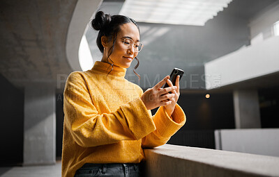 Buy stock photo Woman, phone and texting in office building, thinking and calm while on internet, search and reading. Asian, girl and business entrepreneur with smartphone for research, office space or idea in Japan