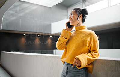 Buy stock photo Phone call, communication and mockup with an asian woman talking while standing in a hallway. Mobile, networking and conversation with an attractive young female speaking on her smartphone indoor