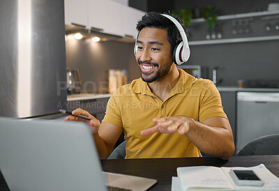Buy stock photo Happy man, headphones and video conference on laptop in home office while online, talking and on webinar. Entrepreneur person at desk working remote with virtual communication for freelance work