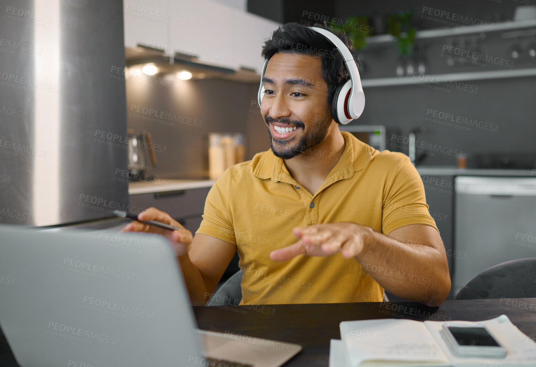 Buy stock photo Happy man, headphones and video conference on laptop in home office while online, talking and on webinar. Entrepreneur person at desk working remote with virtual communication for freelance work