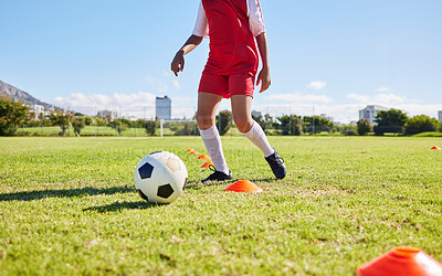 Buy stock photo Soccer child, field and training for fitness, sports and balance for control, speed and strong body development. Cropped football player kid, fast dribbling and exercise feet on grass in Cape Town