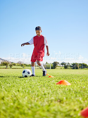 Buy stock photo Football girl kid, grass and training for fitness, sports or balance with talent development, control or speed. Female child, fast football dribbling and exercise feet on field with strong mindset